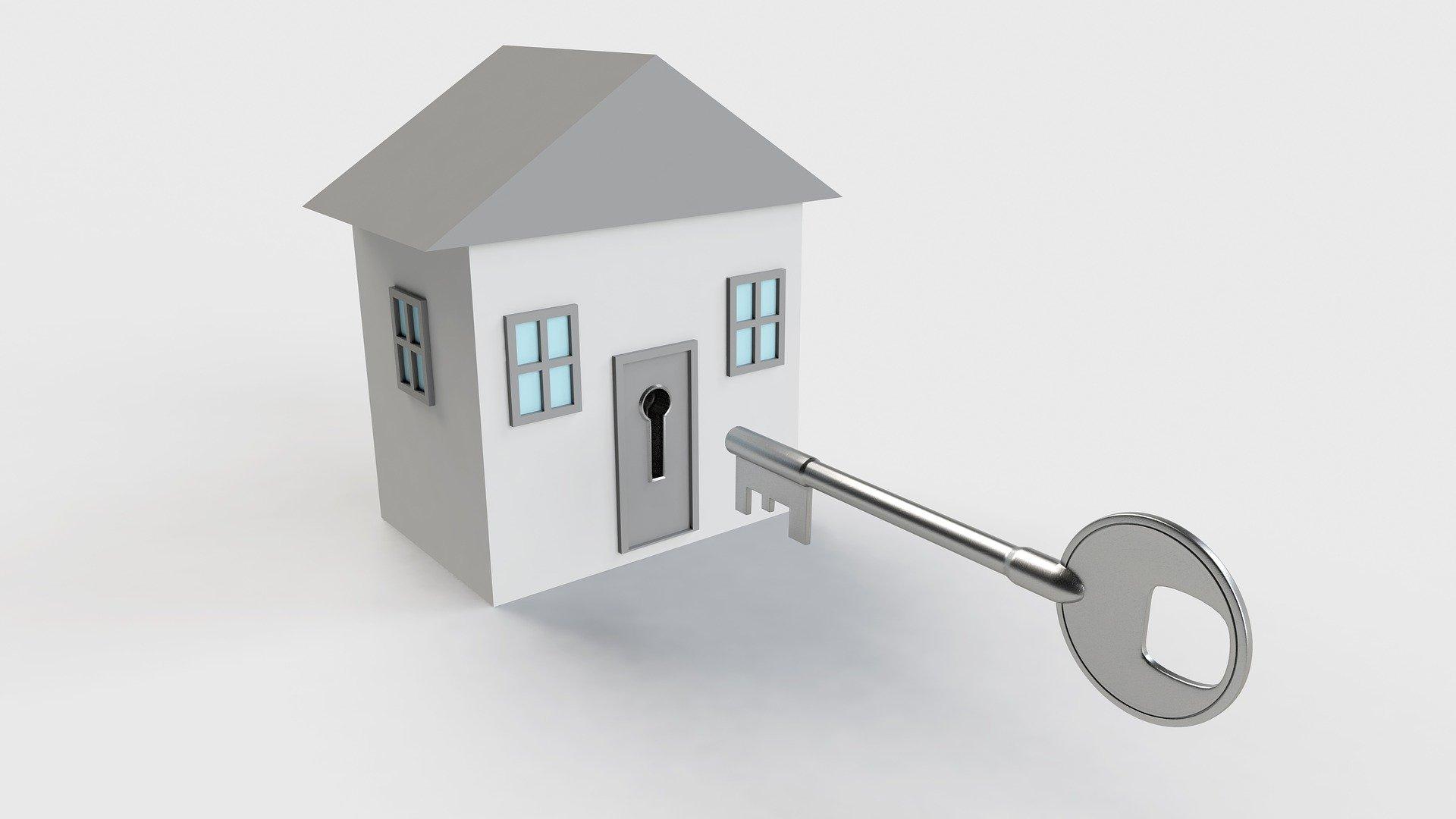 Small house with a large key at the front door, representing access control